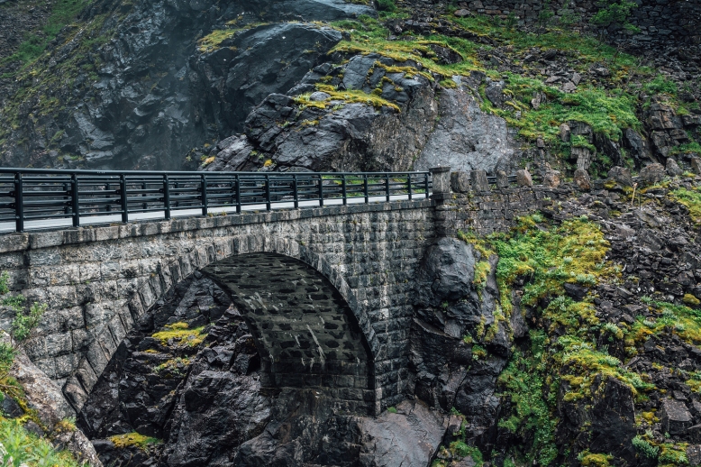 Stone bridge over a canyon at the Trolls path in Norway